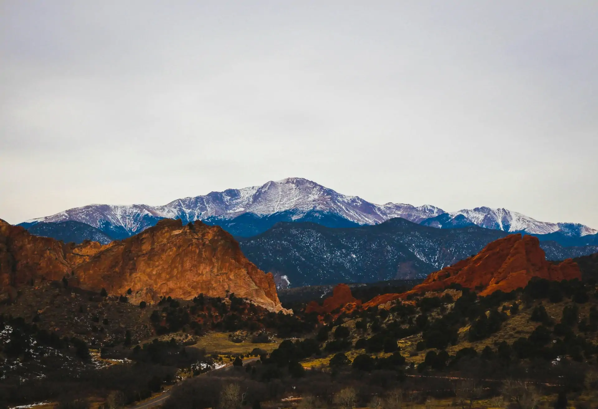 A natural view of Colorado Springs with the Rocky Mountains in the background.