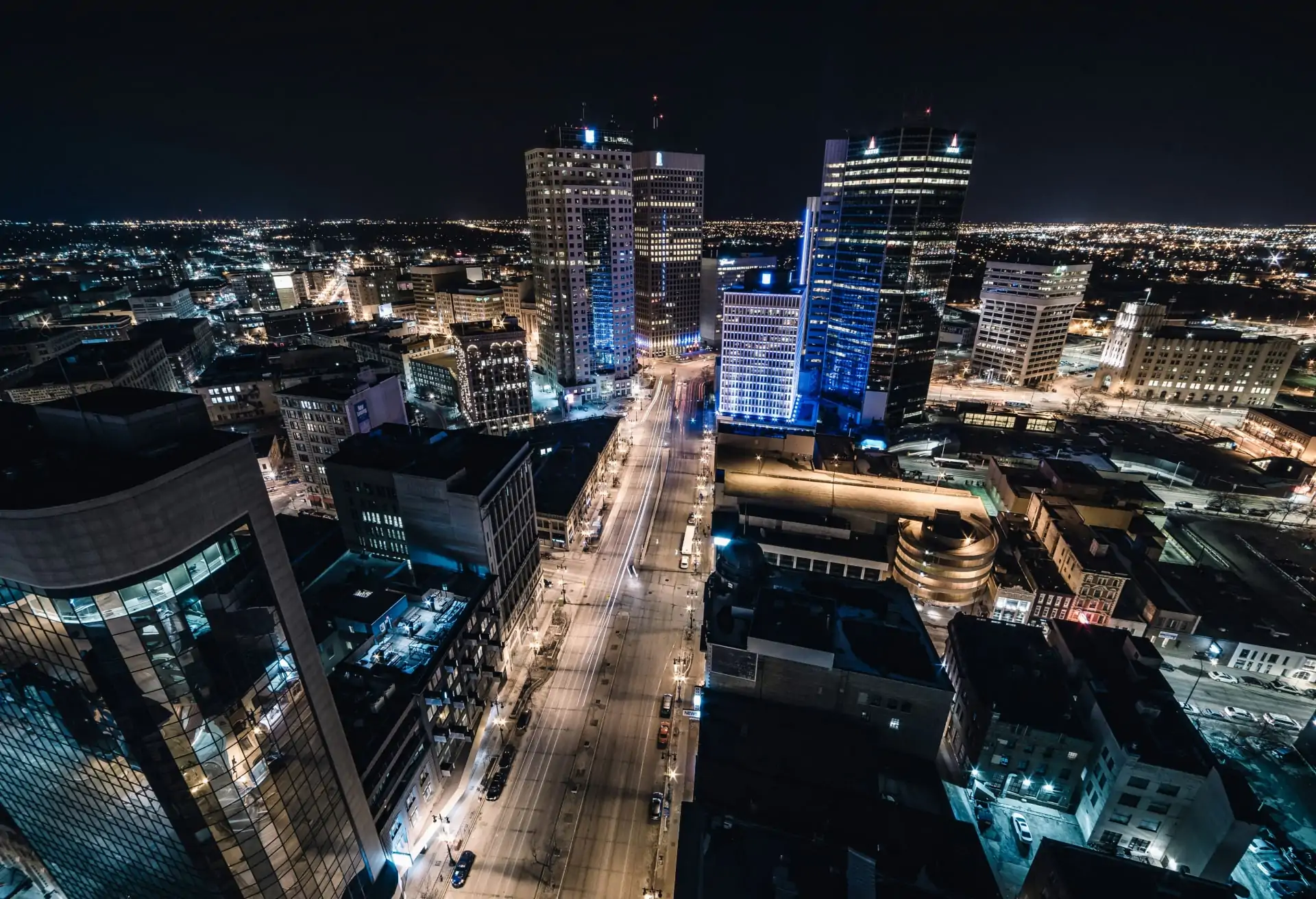 A wide view of Winnipeg's skyline with the river, historical buildings and skyscrapers in the background.