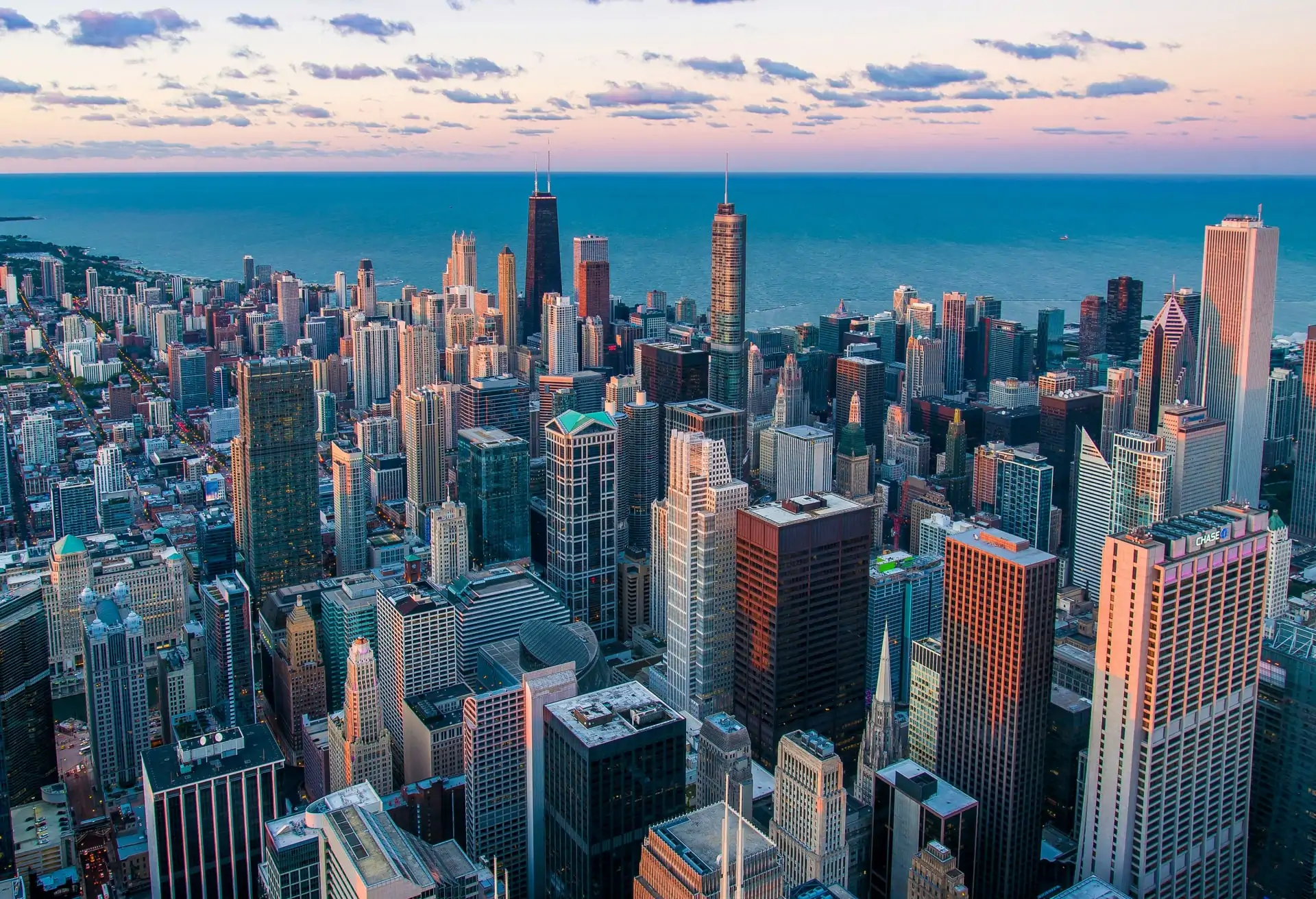 An aerial view of Chicago’s skyline with Lake Michigan and the city’s modern architecture.