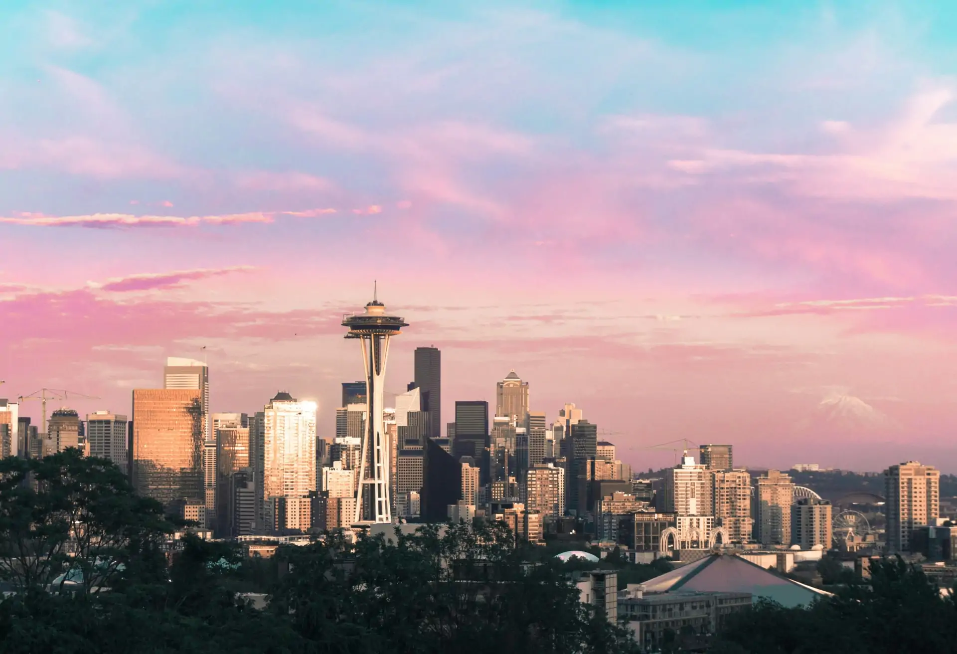 A view of Seattle’s skyline with the Space Needle in the foreground at sunset.