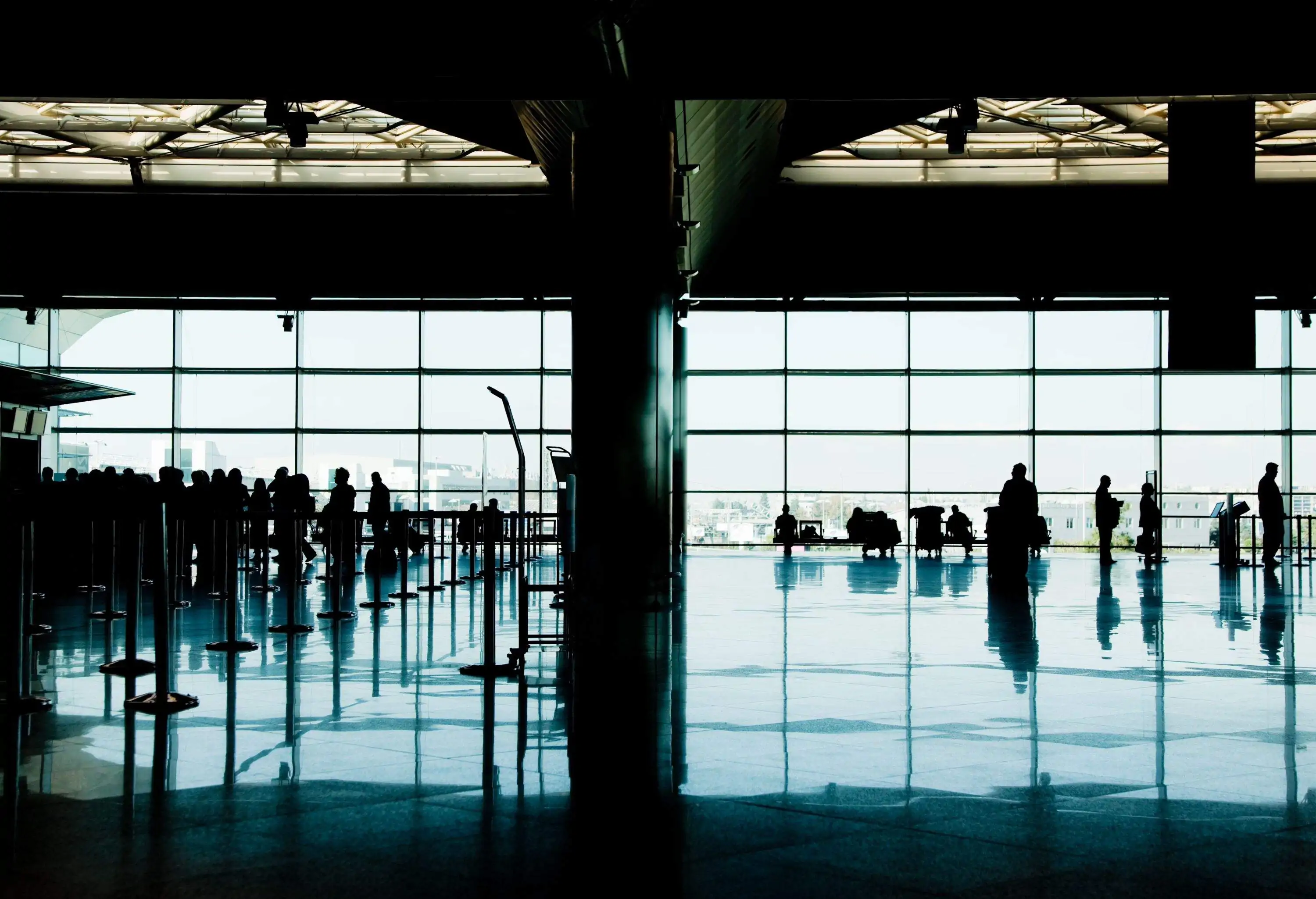 View of people's silhouettes at busy international airport